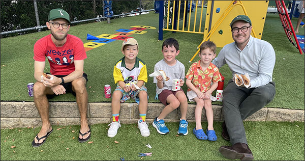 Parents and children enjoying the Welcome BBQ event.