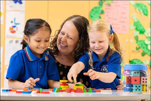 Teacher supporting students with their learning